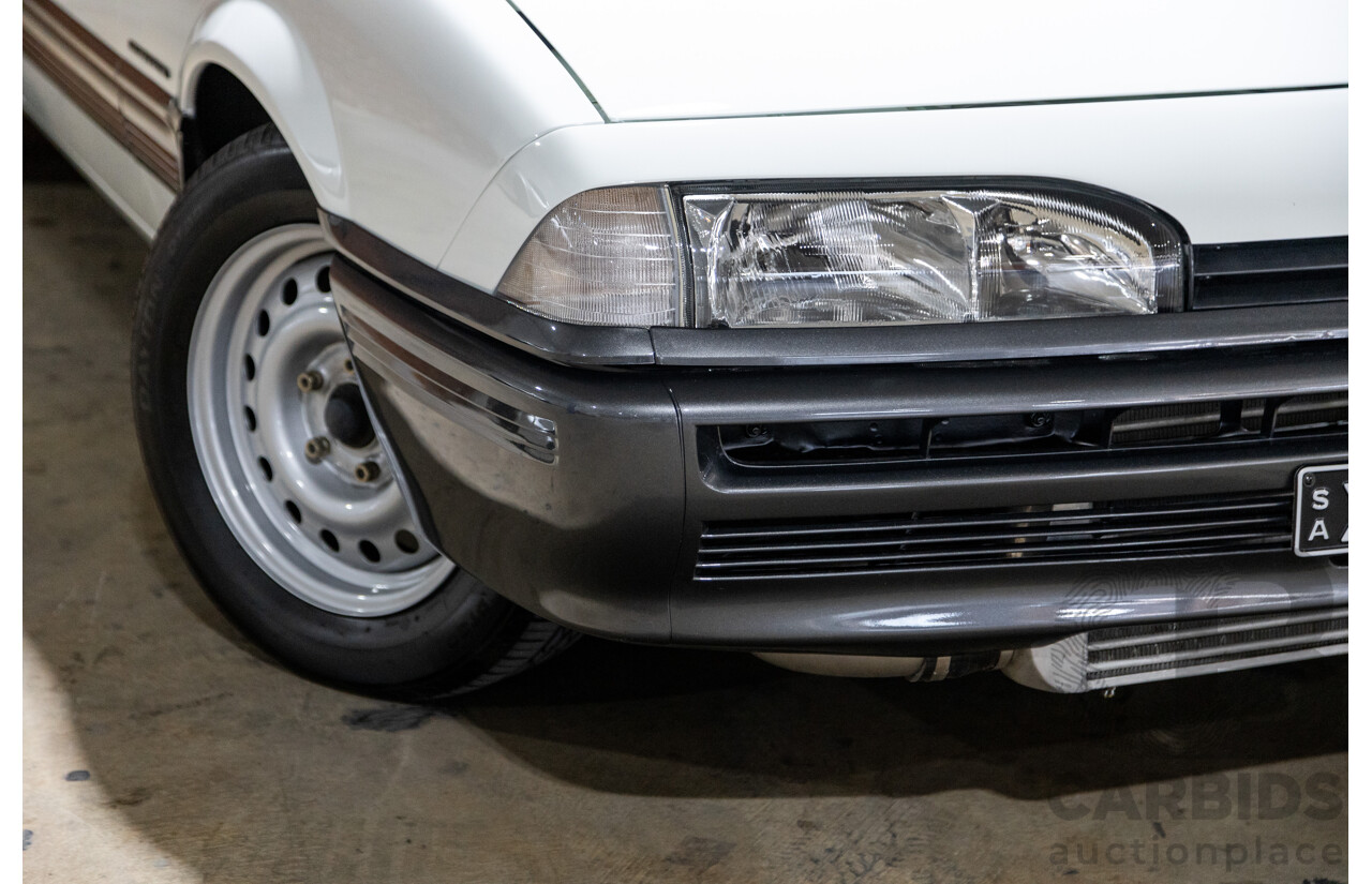 6/1987 Holden Commodore VL Turbo SL BT1 4d Sedan White Turbo 3.0L - Ex-Police - Modified