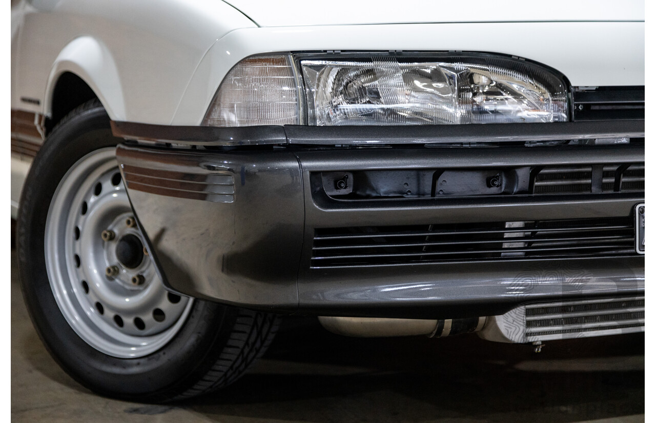 6/1987 Holden Commodore VL Turbo SL BT1 4d Sedan White Turbo 3.0L - Ex-Police - Modified