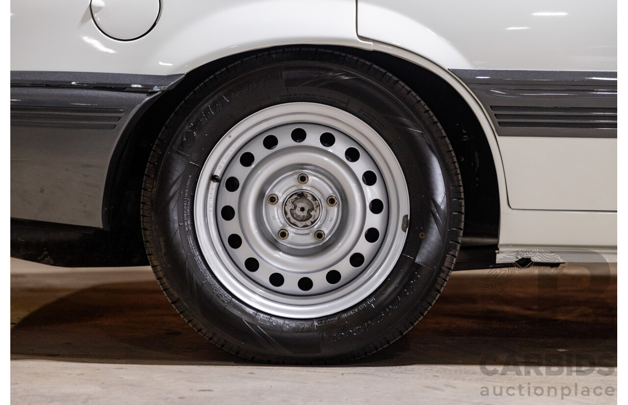 6/1987 Holden Commodore VL Turbo SL BT1 4d Sedan White Turbo 3.0L - Ex-Police - Modified