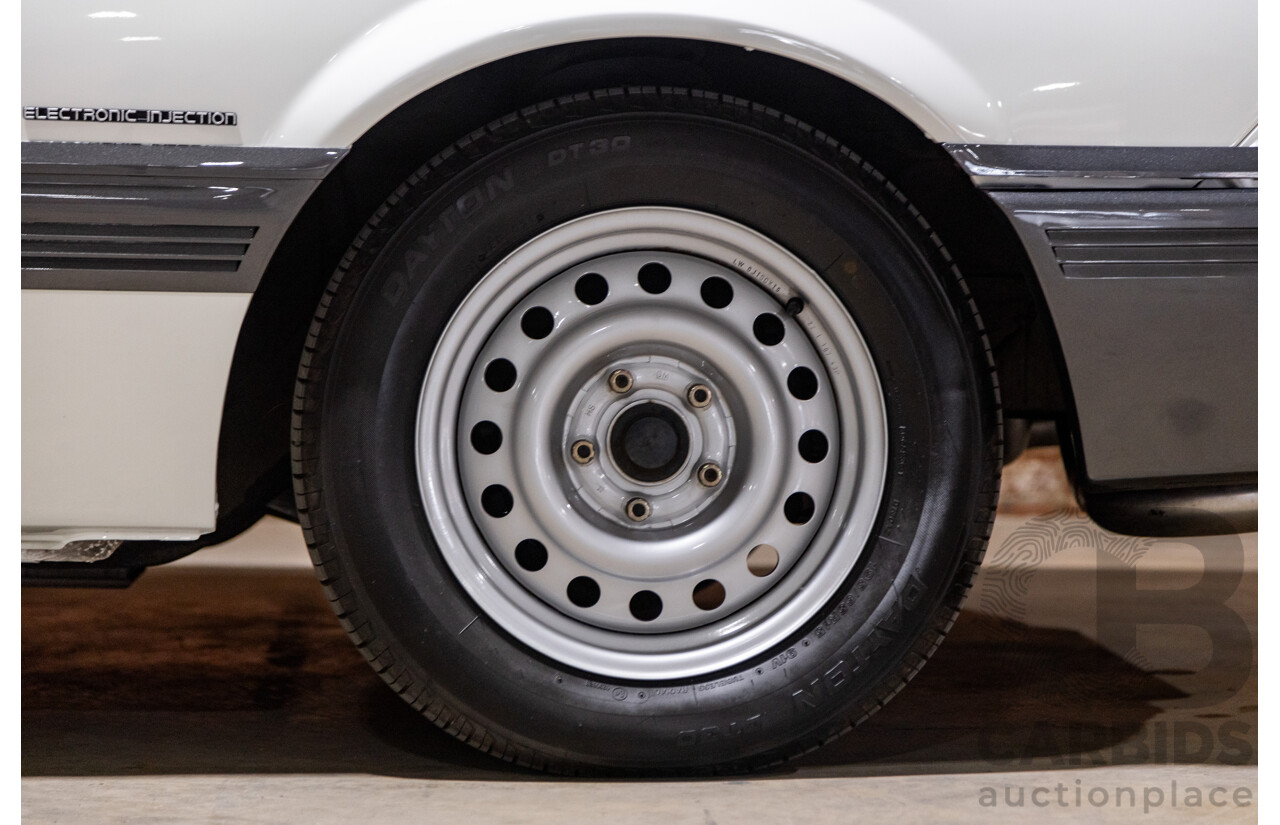 6/1987 Holden Commodore VL Turbo SL BT1 4d Sedan White Turbo 3.0L - Ex-Police - Modified