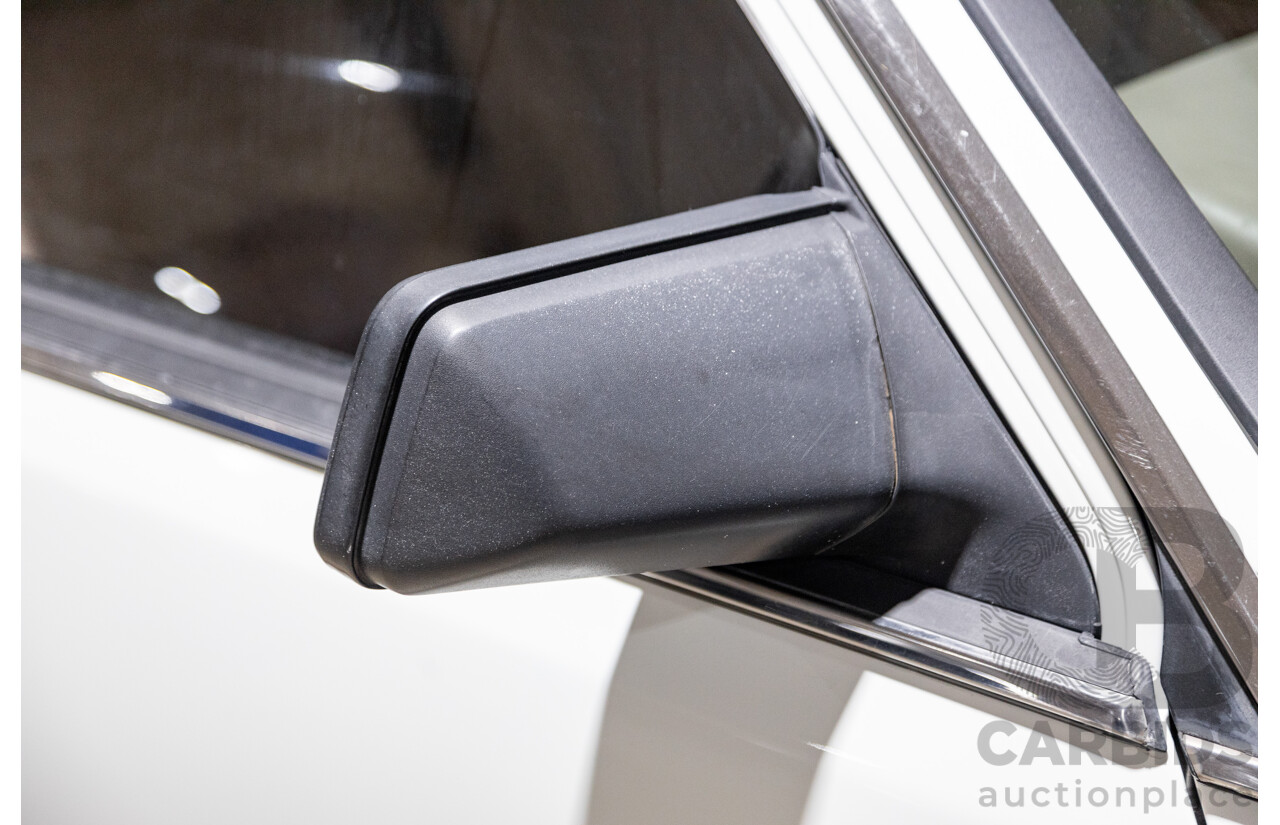 6/1987 Holden Commodore VL Turbo SL BT1 4d Sedan White Turbo 3.0L - Ex-Police - Modified