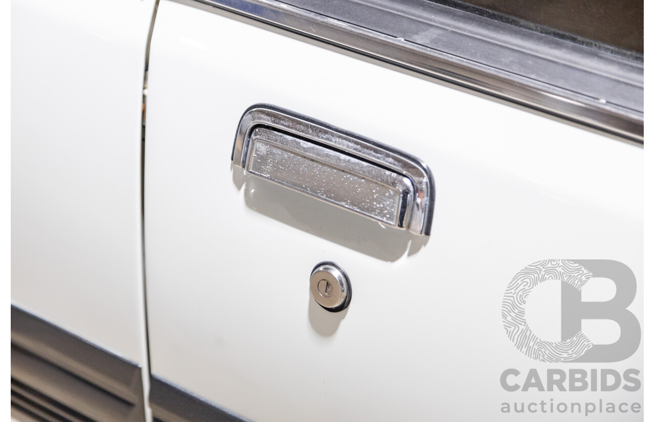 6/1987 Holden Commodore VL Turbo SL BT1 4d Sedan White Turbo 3.0L - Ex-Police - Modified