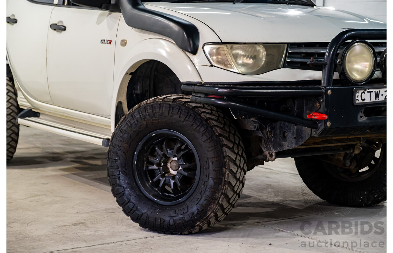 10/2014 Mitsubishi Triton Glx-R (4x4) MN MY14 Update 4d Double Cab Utility White Turbo Diesel 2.5L