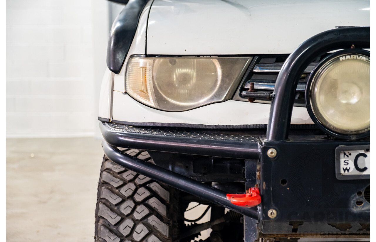 10/2014 Mitsubishi Triton Glx-R (4x4) MN MY14 Update 4d Double Cab Utility White Turbo Diesel 2.5L