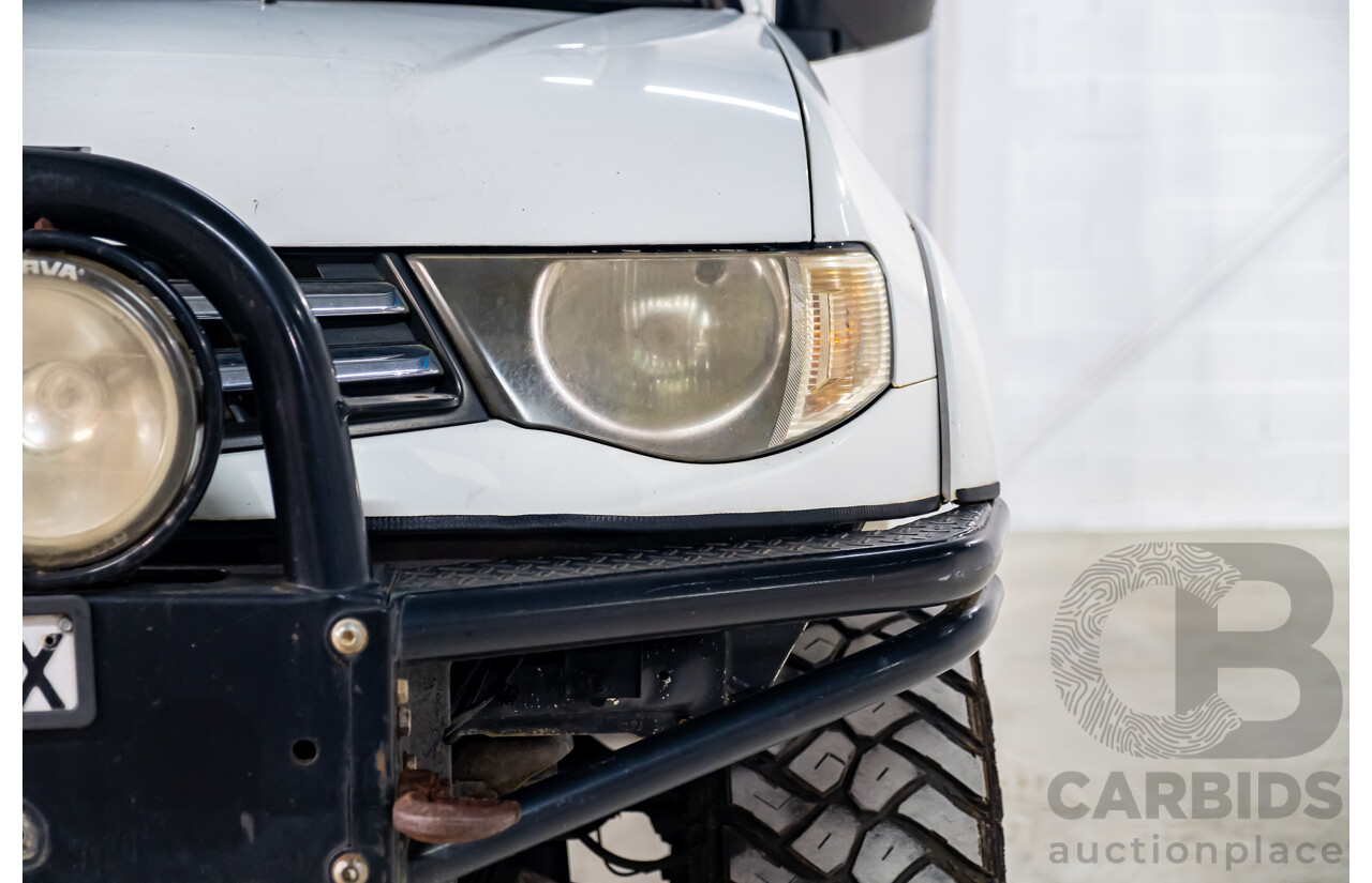 10/2014 Mitsubishi Triton Glx-R (4x4) MN MY14 Update 4d Double Cab Utility White Turbo Diesel 2.5L