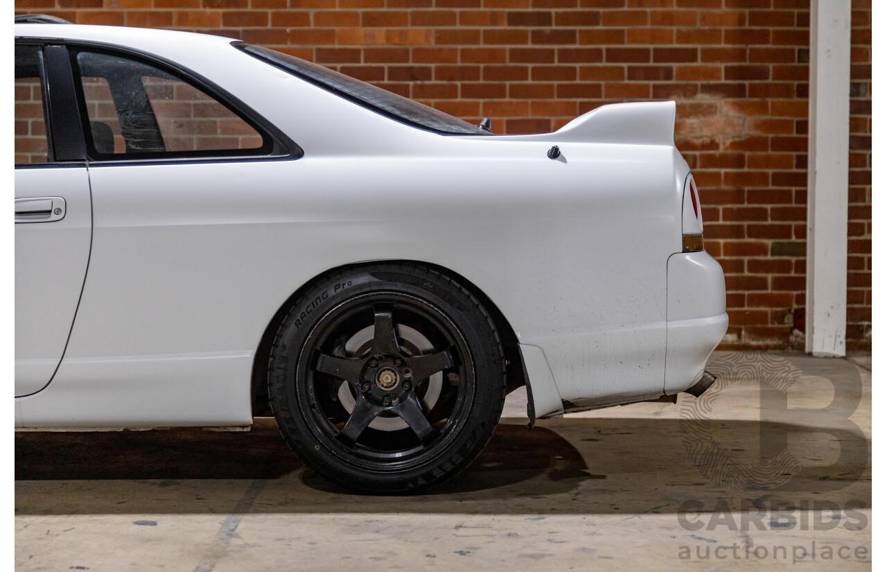 10/1994 Nissan Skyline R33 2d Coupe Ivory Matte White Wrap Turbo 4.0L - Modified with Barra Conversion - 07/2008 Import