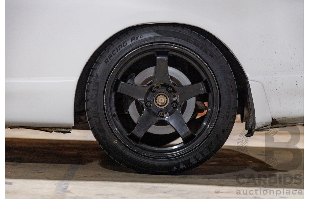 10/1994 Nissan Skyline R33 2d Coupe Ivory Matte White Wrap Turbo 4.0L - Modified with Barra Conversion - 07/2008 Import