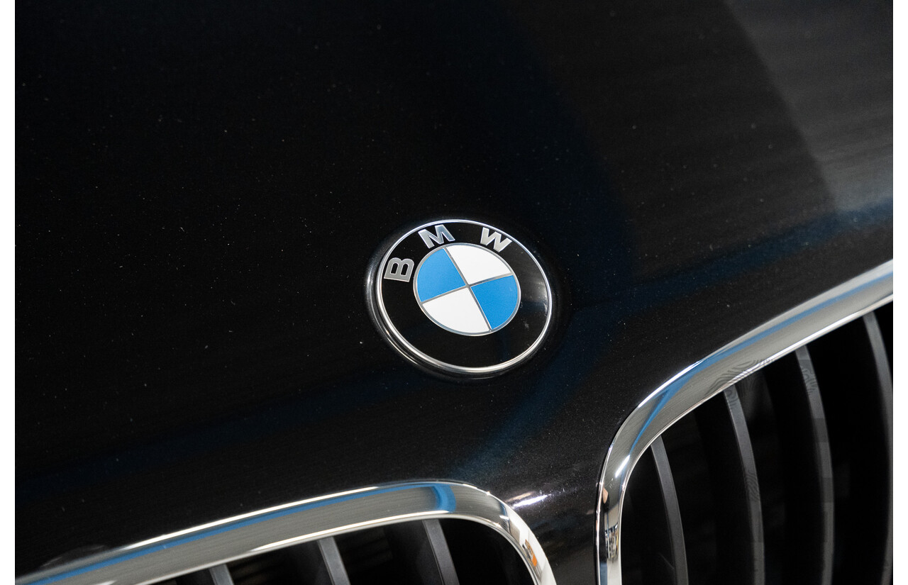 1/2012 BMW X5 Xdrive 35i E70 MY12 Upgrade 4d Wagon Black Turbo 3.0L - 7 Seater