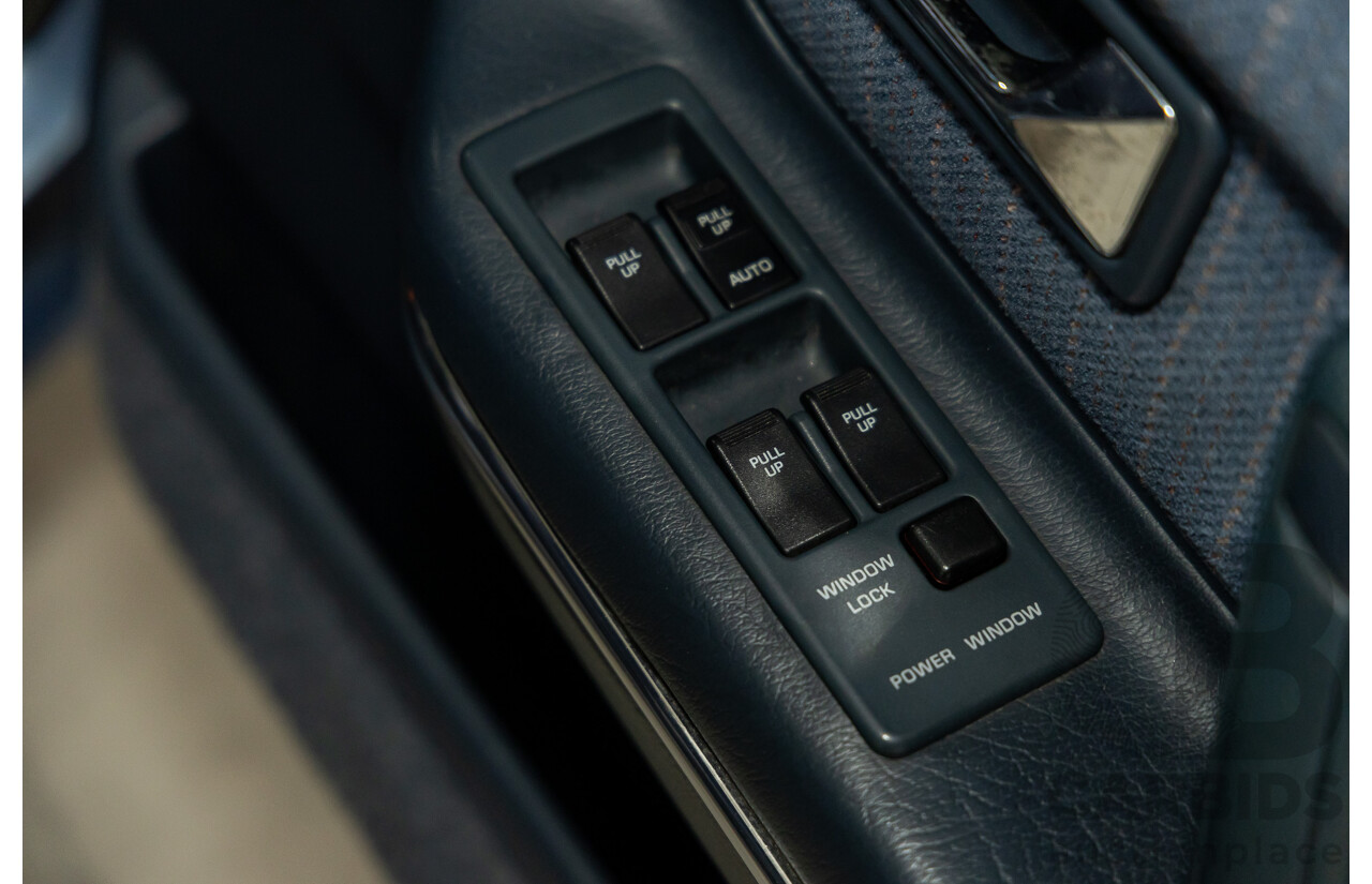 7/1990 Ford Telstar TX5 GHIA AV 5d Hatchback Jeans Blue 2.2L