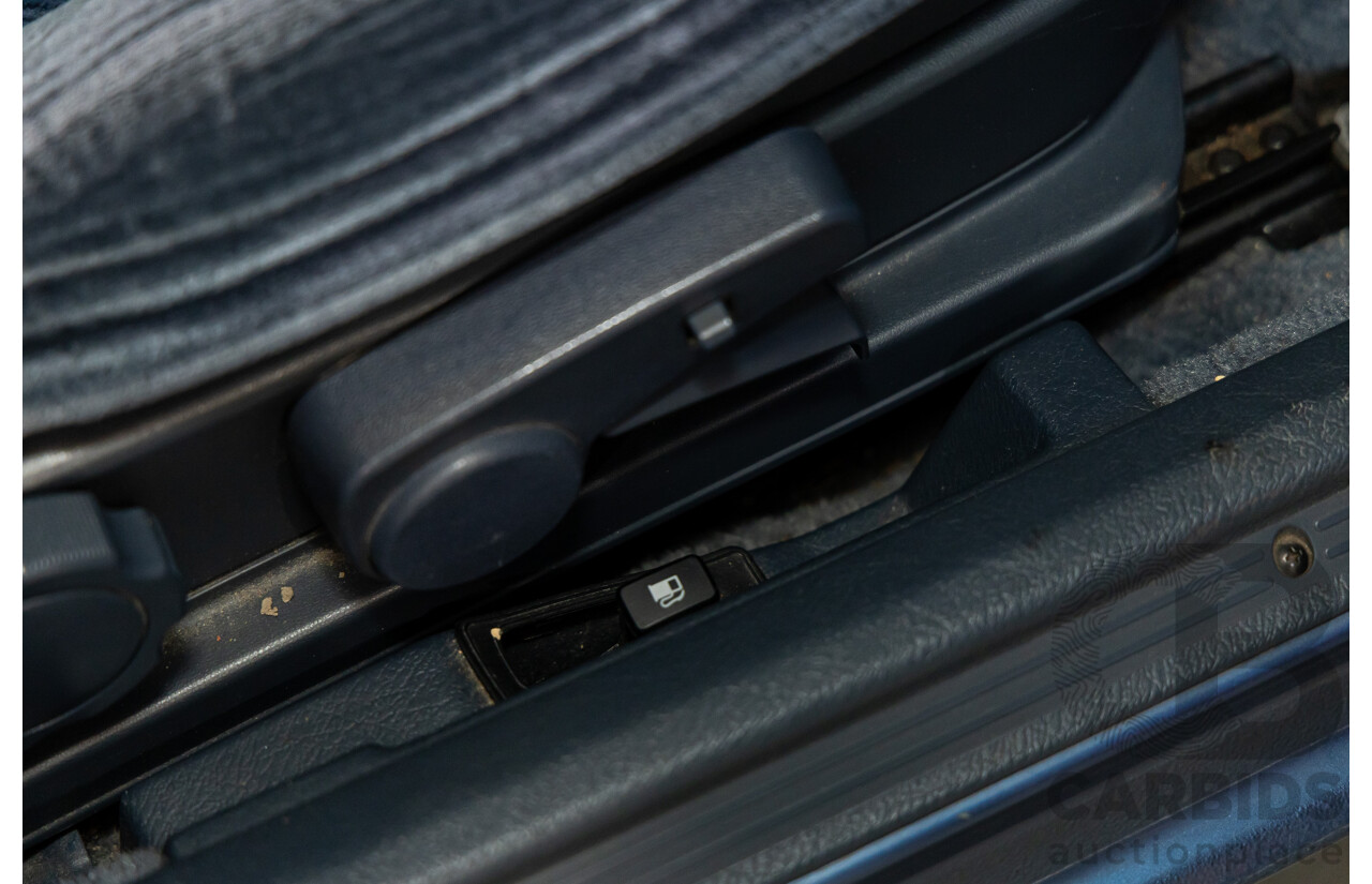 7/1990 Ford Telstar TX5 GHIA AV 5d Hatchback Jeans Blue 2.2L