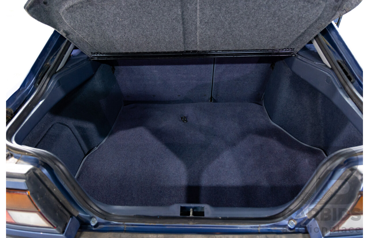 7/1990 Ford Telstar TX5 GHIA AV 5d Hatchback Jeans Blue 2.2L