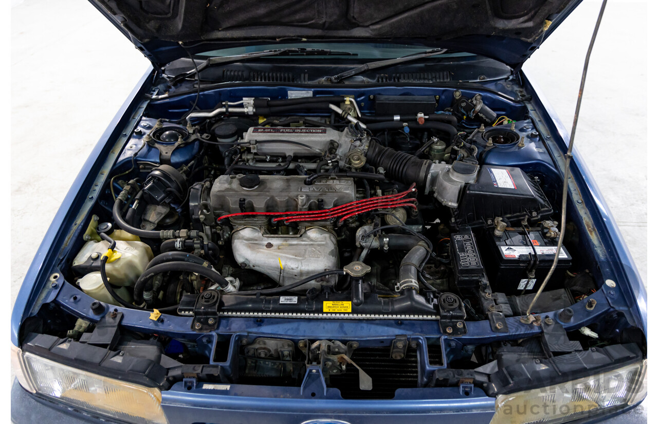 7/1990 Ford Telstar TX5 GHIA AV 5d Hatchback Jeans Blue 2.2L