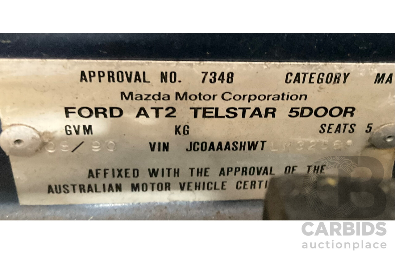 7/1990 Ford Telstar TX5 GHIA AV 5d Hatchback Jeans Blue 2.2L