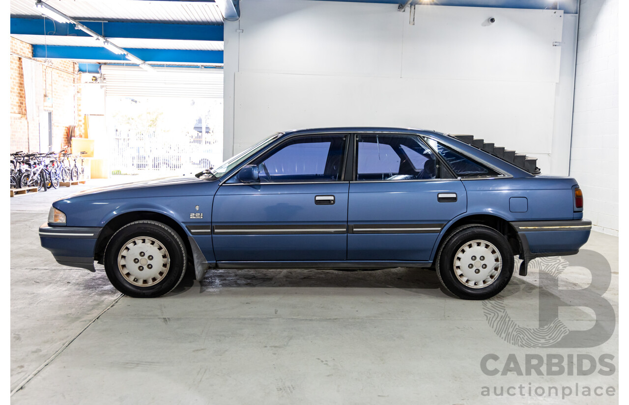 7/1990 Ford Telstar TX5 GHIA AV 5d Hatchback Jeans Blue 2.2L
