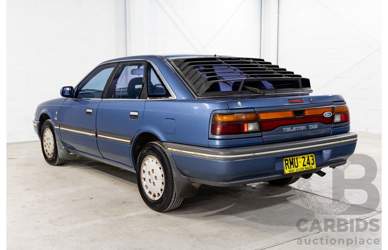 7/1990 Ford Telstar TX5 GHIA AV 5d Hatchback Jeans Blue 2.2L