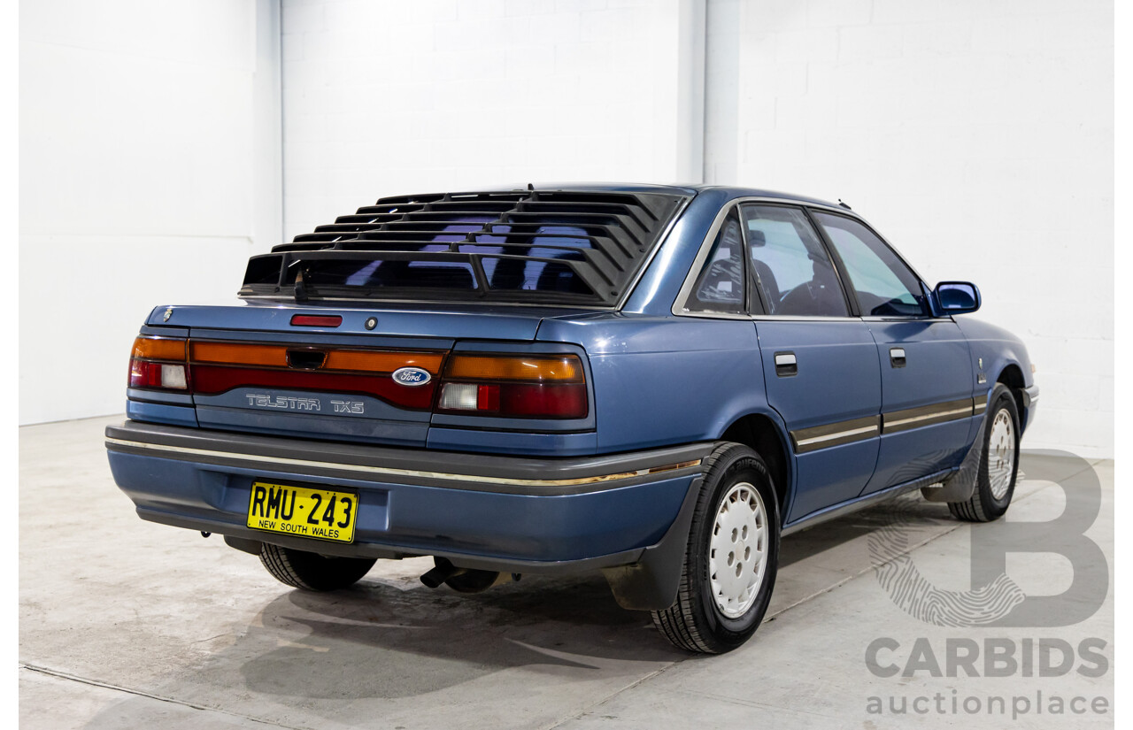 7/1990 Ford Telstar TX5 GHIA AV 5d Hatchback Jeans Blue 2.2L