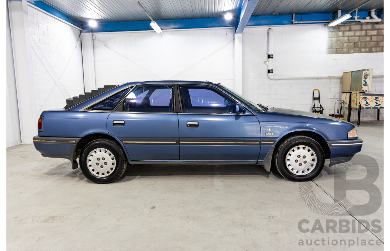 7/1990 Ford Telstar TX5 GHIA AV 5d Hatchback Jeans Blue 2.2L