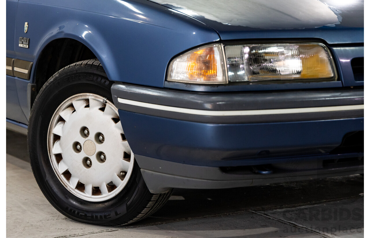 7/1990 Ford Telstar TX5 GHIA AV 5d Hatchback Jeans Blue 2.2L