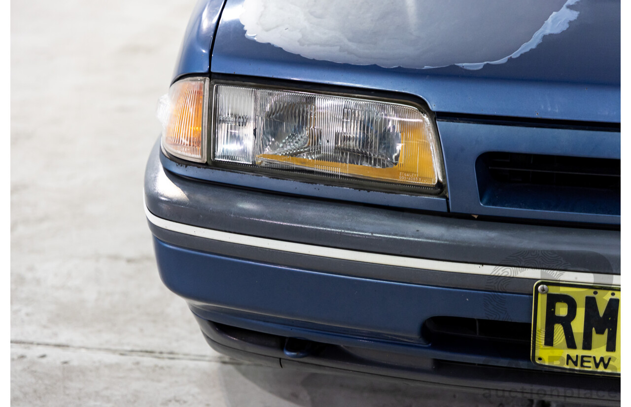 7/1990 Ford Telstar TX5 GHIA AV 5d Hatchback Jeans Blue 2.2L