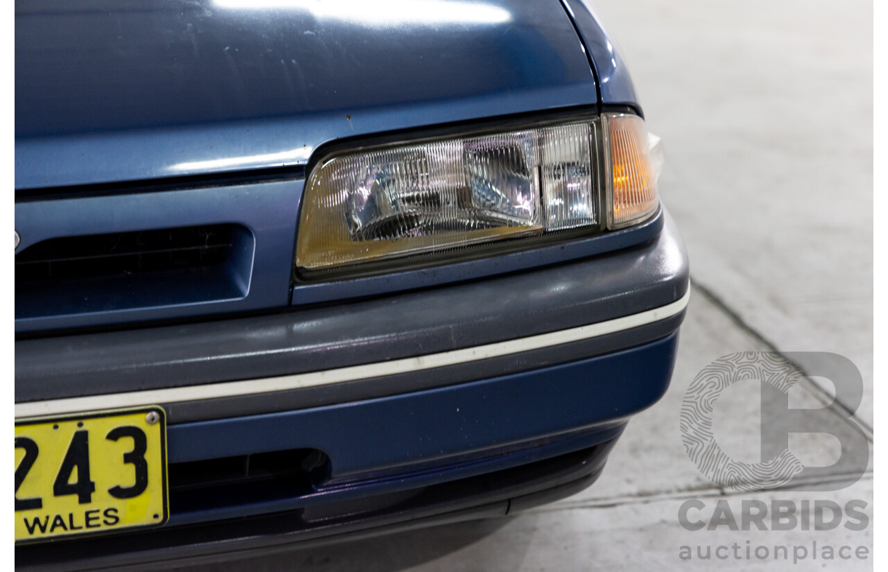 7/1990 Ford Telstar TX5 GHIA AV 5d Hatchback Jeans Blue 2.2L