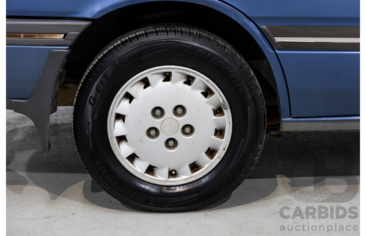 7/1990 Ford Telstar TX5 GHIA AV 5d Hatchback Jeans Blue 2.2L