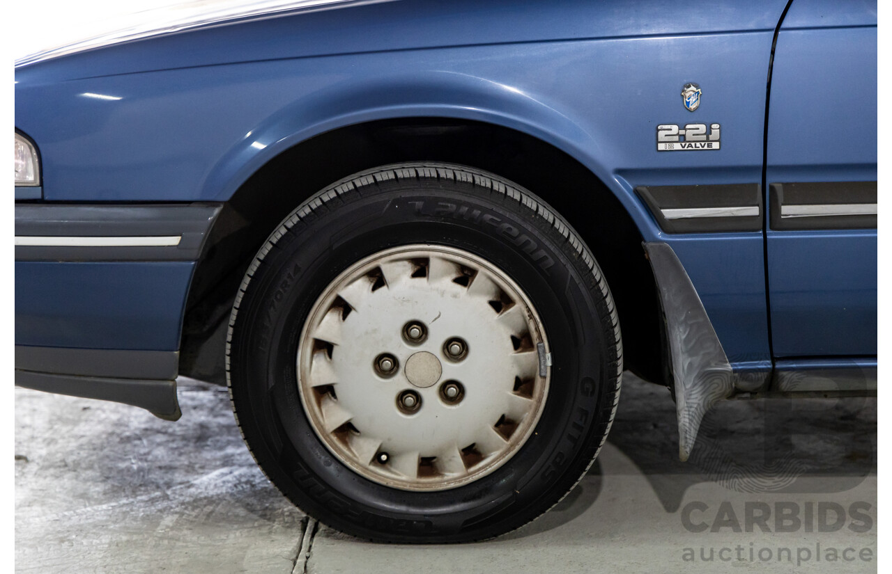 7/1990 Ford Telstar TX5 GHIA AV 5d Hatchback Jeans Blue 2.2L