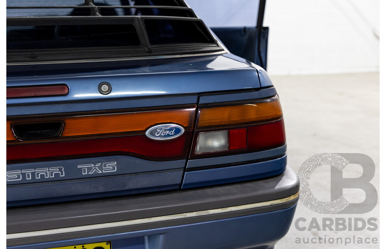 7/1990 Ford Telstar TX5 GHIA AV 5d Hatchback Jeans Blue 2.2L