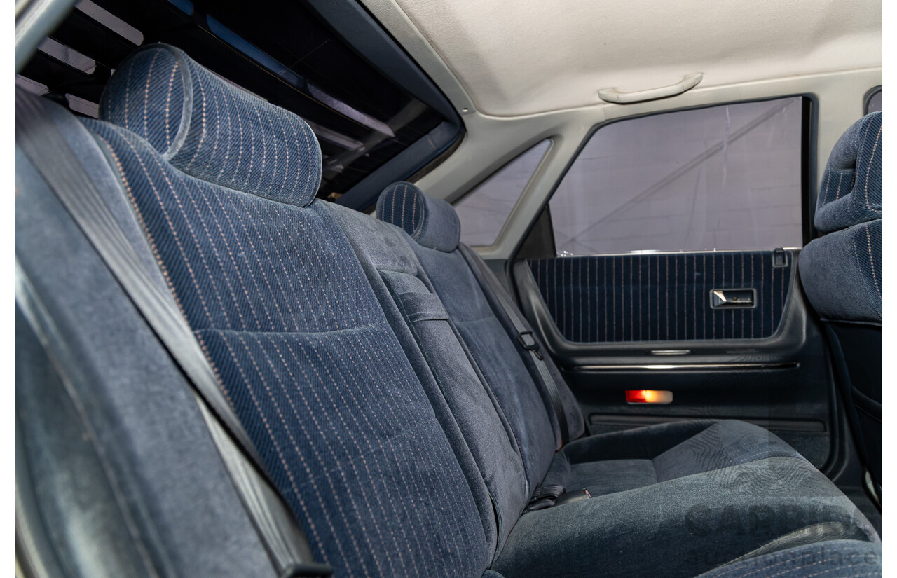 7/1990 Ford Telstar TX5 GHIA AV 5d Hatchback Jeans Blue 2.2L