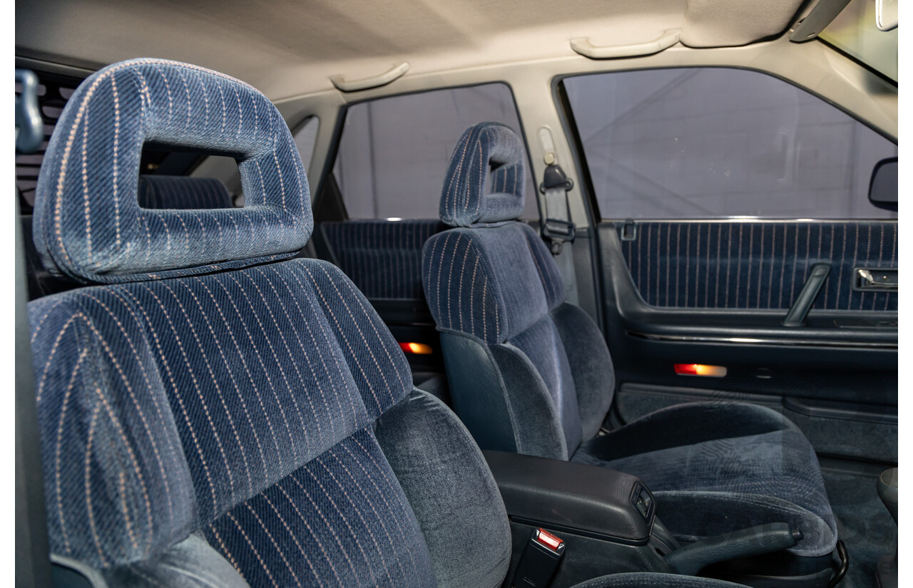 7/1990 Ford Telstar TX5 GHIA AV 5d Hatchback Jeans Blue 2.2L