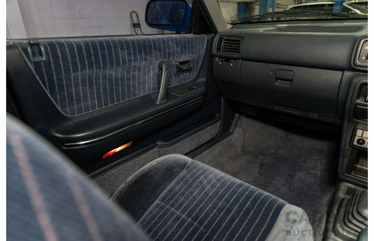 7/1990 Ford Telstar TX5 GHIA AV 5d Hatchback Jeans Blue 2.2L