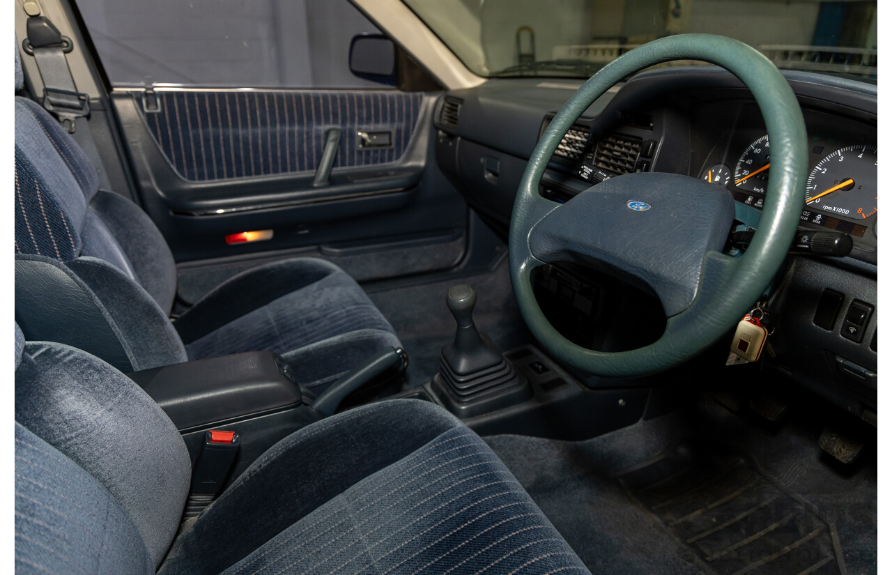 7/1990 Ford Telstar TX5 GHIA AV 5d Hatchback Jeans Blue 2.2L