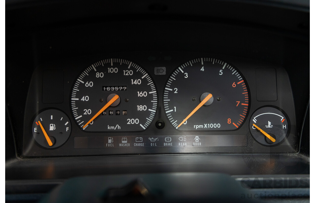 7/1990 Ford Telstar TX5 GHIA AV 5d Hatchback Jeans Blue 2.2L