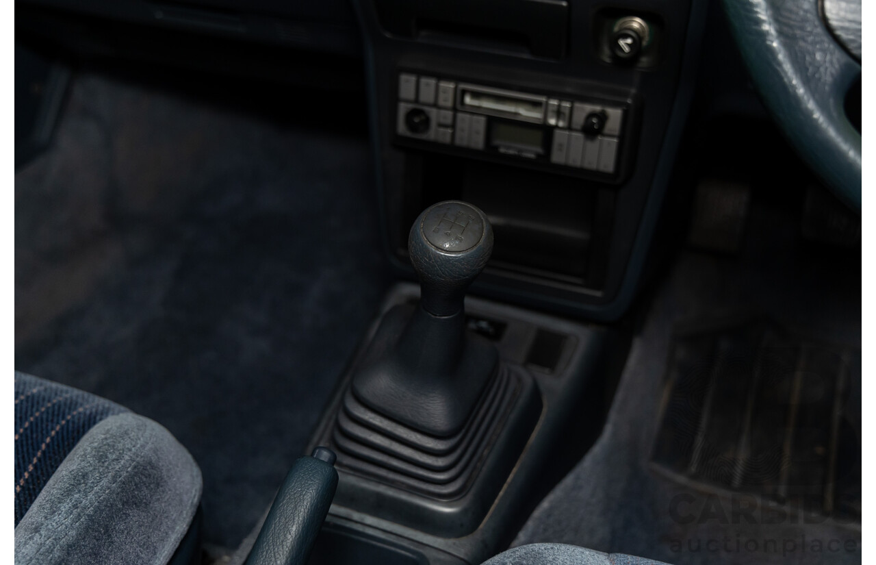 7/1990 Ford Telstar TX5 GHIA AV 5d Hatchback Jeans Blue 2.2L