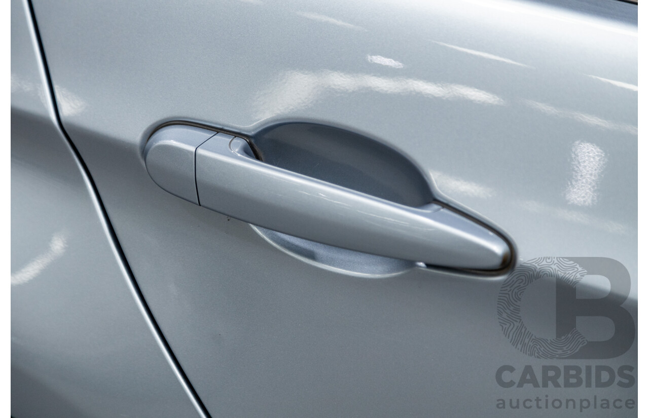 4/2009 BMW 320i Executive E90 MY09 4d Sedan Bluewater Metallic 2.0L