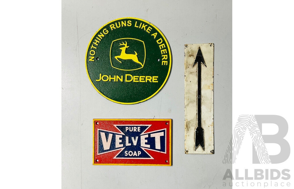 Collection of Three Painted Reproduction Cast Iron Wall Signs Including John Deere Sign and Pure Velvet Sign