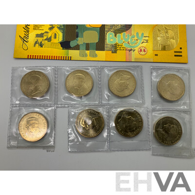 Eight Australian 2024 Commemorative One Dollar Coins, Bluey Bucks, Three Novelty Fifty Dollar Bluey Notes and Japanese WW2 One Gulden Note