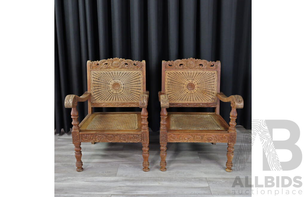Pair of Vintage Heavily Carved Tropical Hardwood Armchairs