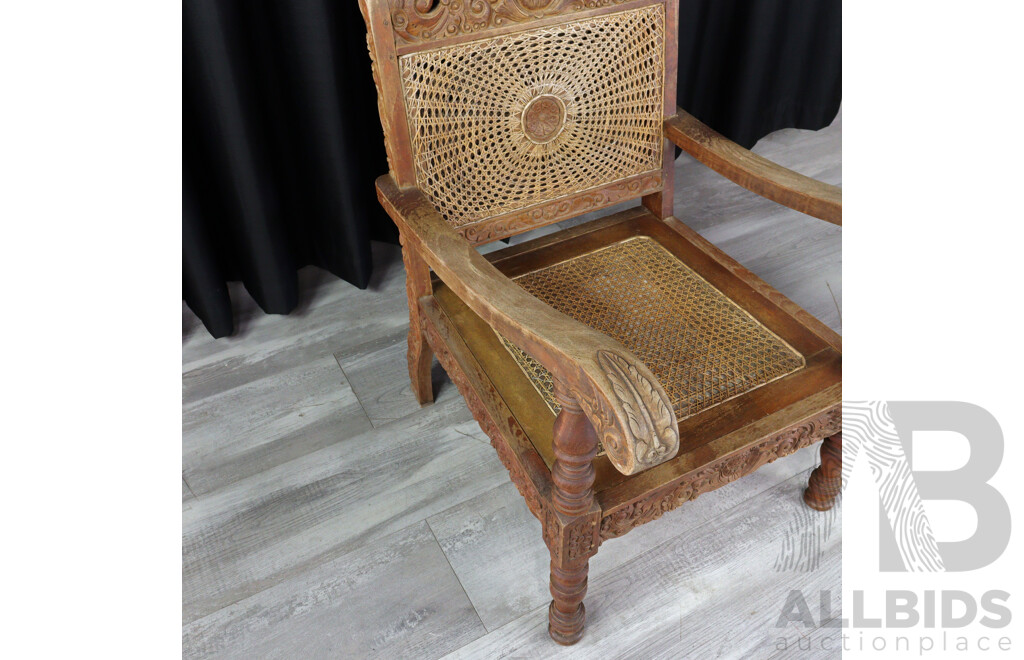 Pair of Vintage Heavily Carved Tropical Hardwood Armchairs