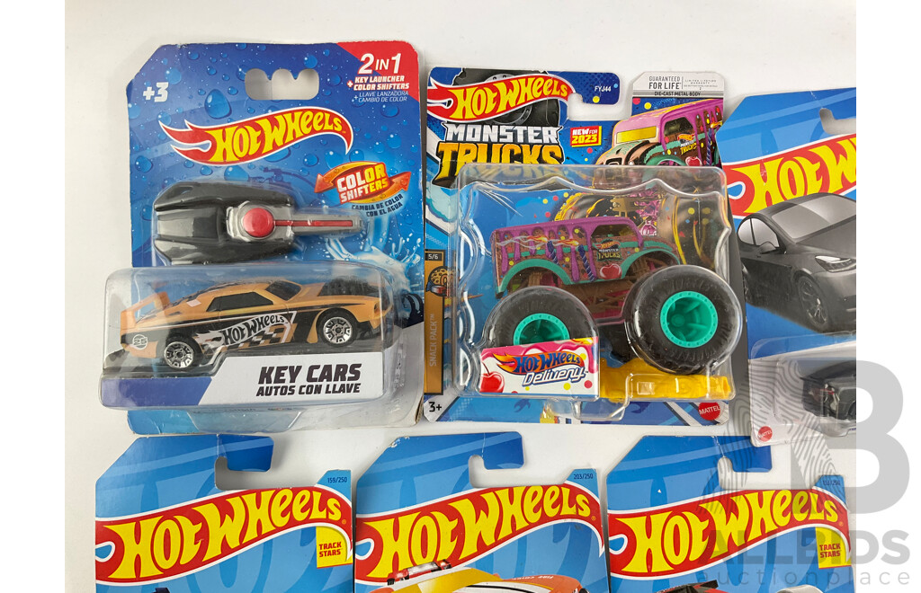 Collection of Boxed Hot Wheels Including Monster Trucks and Key Cars