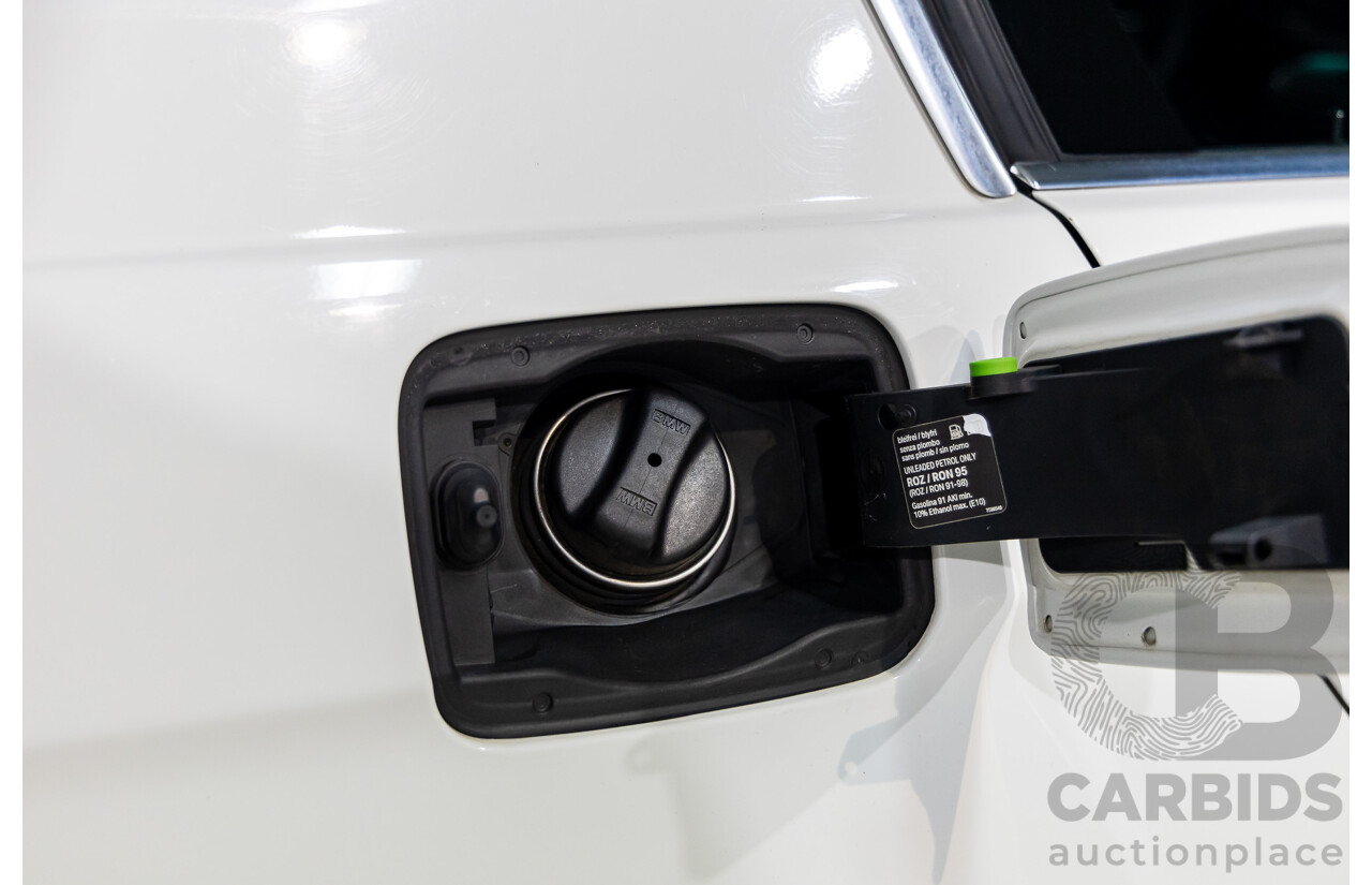 9/2010 BMW 325i Exclusive E90 MY10 4d Sedan Alpine White 2.5L