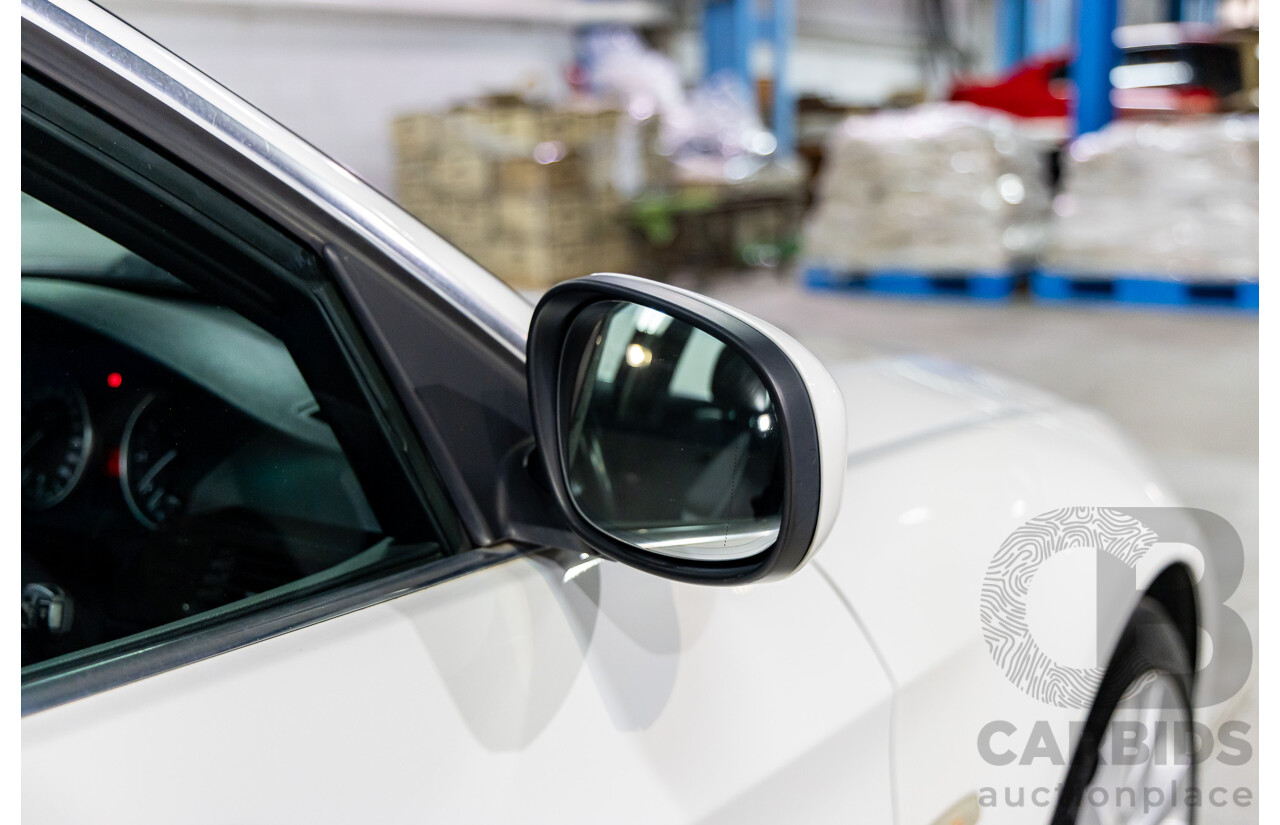 9/2010 BMW 325i Exclusive E90 MY10 4d Sedan Alpine White 2.5L