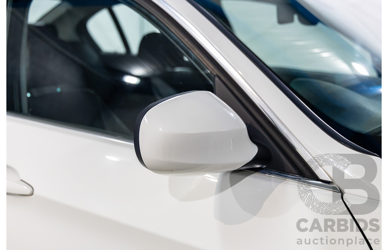 9/2010 BMW 325i Exclusive E90 MY10 4d Sedan Alpine White 2.5L