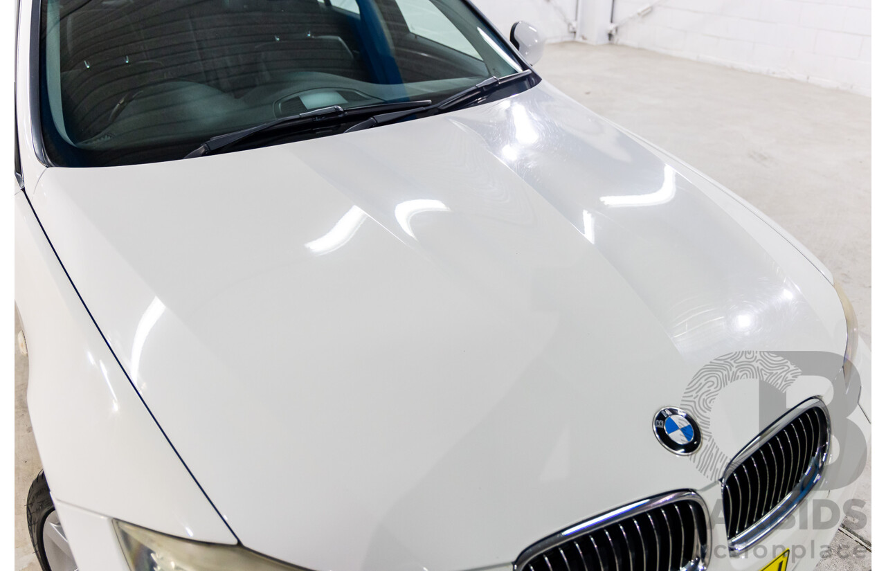 9/2010 BMW 325i Exclusive E90 MY10 4d Sedan Alpine White 2.5L