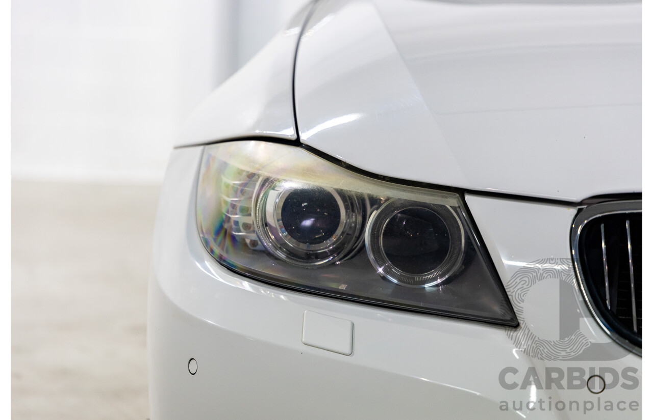 9/2010 BMW 325i Exclusive E90 MY10 4d Sedan Alpine White 2.5L