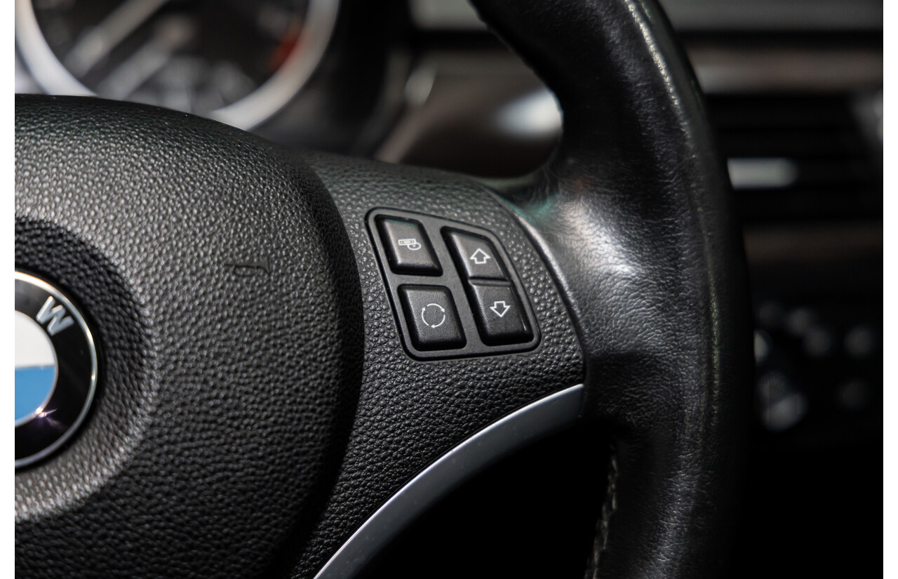 9/2010 BMW 325i Exclusive E90 MY10 4d Sedan Alpine White 2.5L