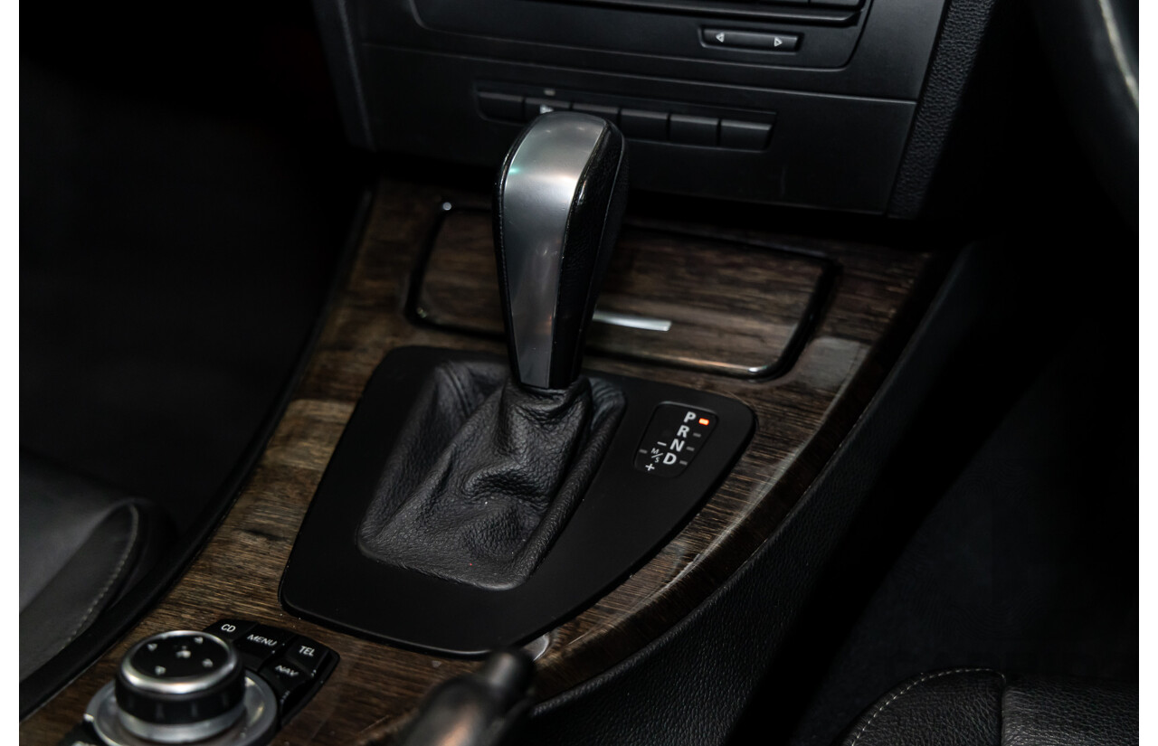 9/2010 BMW 325i Exclusive E90 MY10 4d Sedan Alpine White 2.5L