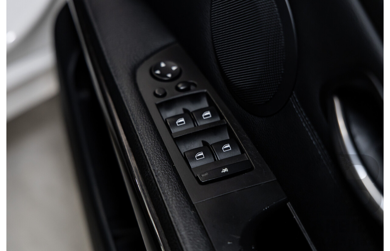 9/2010 BMW 325i Exclusive E90 MY10 4d Sedan Alpine White 2.5L