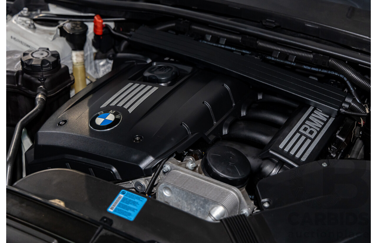 9/2010 BMW 325i Exclusive E90 MY10 4d Sedan Alpine White 2.5L