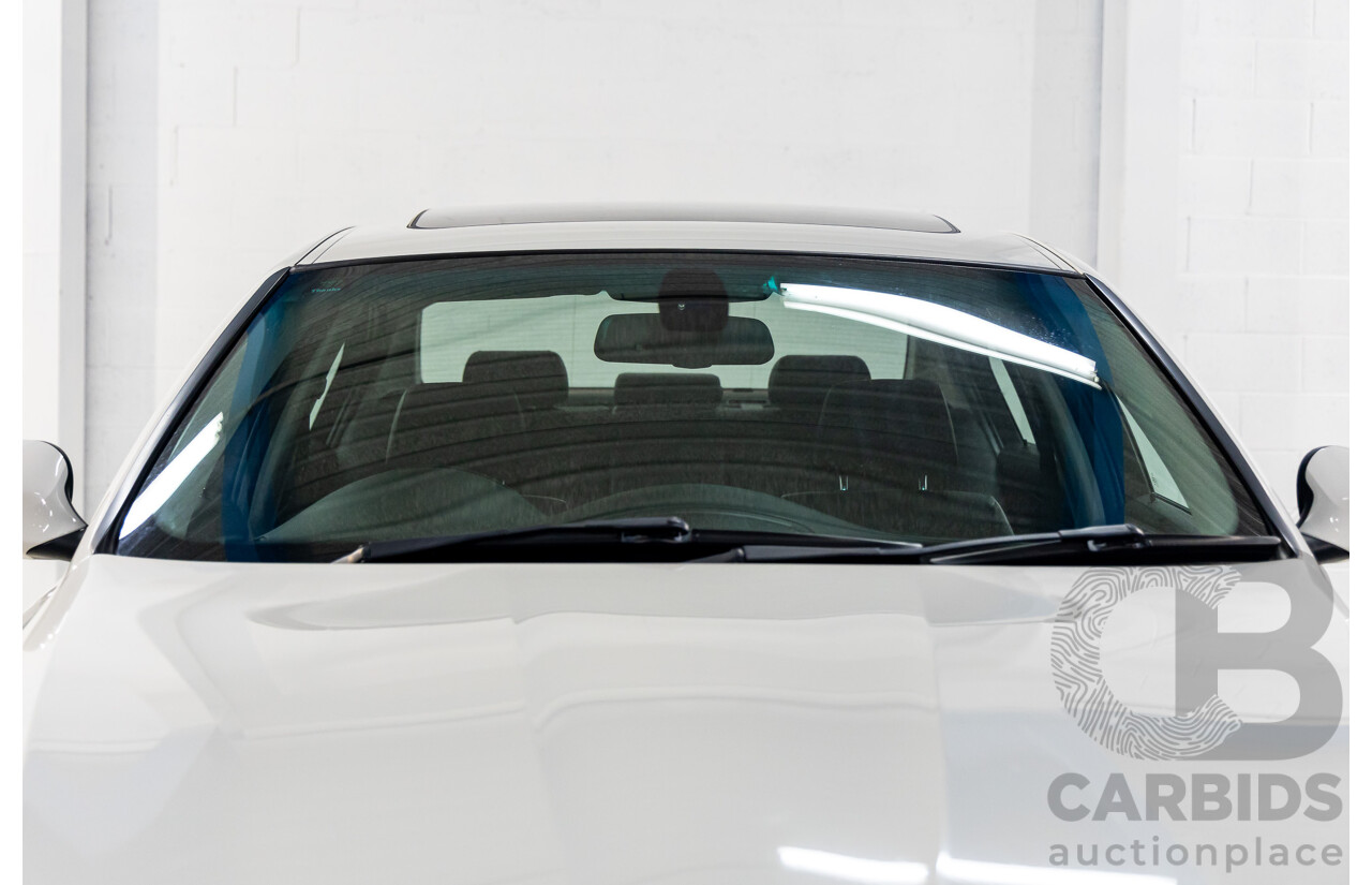 9/2010 BMW 325i Exclusive E90 MY10 4d Sedan Alpine White 2.5L