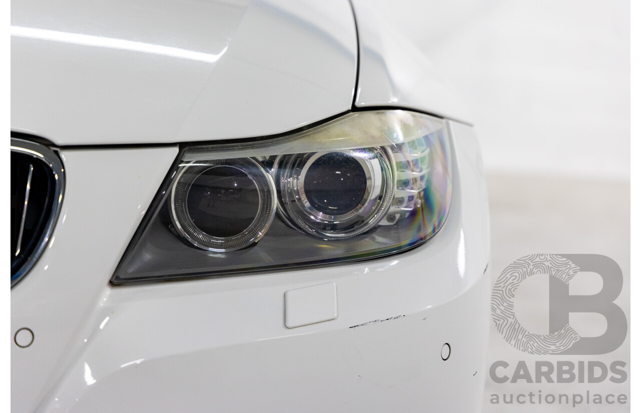 9/2010 BMW 325i Exclusive E90 MY10 4d Sedan Alpine White 2.5L